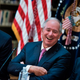 Stephen A. Schwarzman (center), CEO of the Blackstone Group which is purchasing a majority stake in Ancestry.com, sits with President Donald Trump (left) and Chris Liddell (right) at the White House on April 11, 2017.